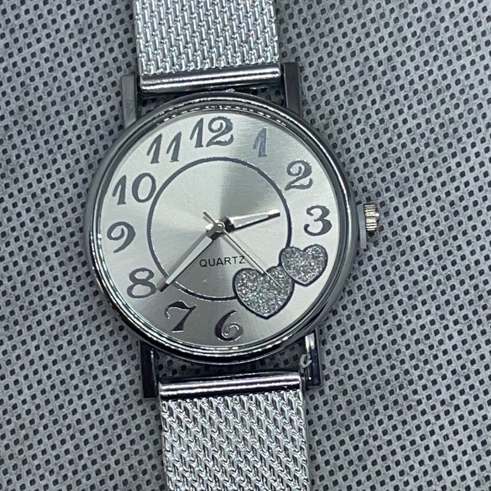 Quartz watch with cute heart accents.